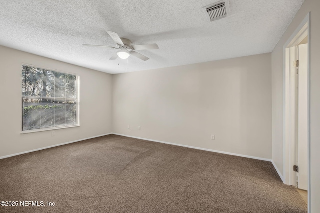 spare room with a textured ceiling, ceiling fan, and carpet flooring