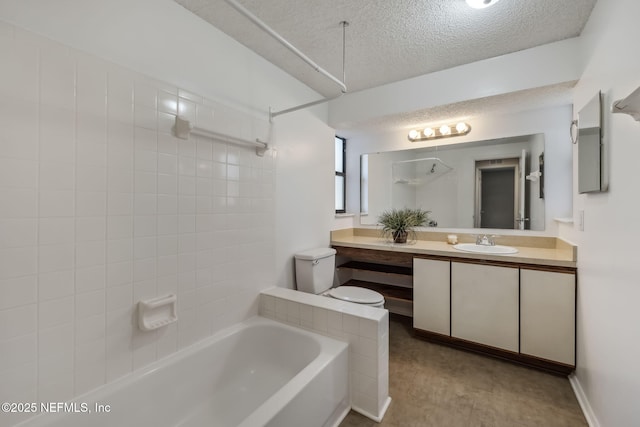 full bathroom with tiled shower / bath, vanity, toilet, and a textured ceiling