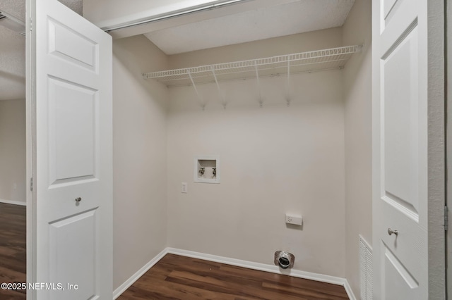 laundry room with dark hardwood / wood-style flooring and hookup for a washing machine