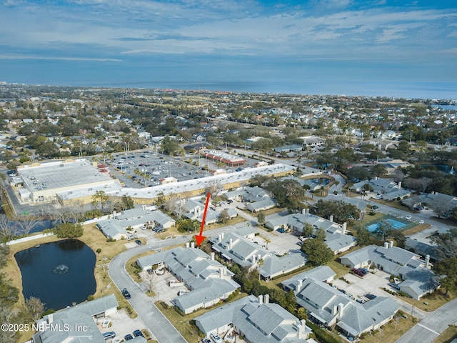 drone / aerial view with a water view