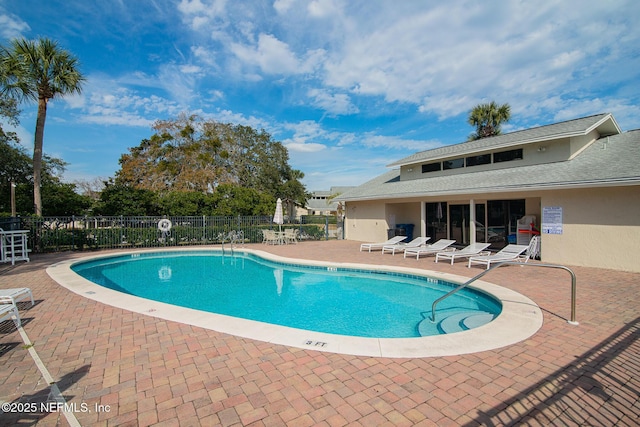 view of swimming pool with a patio