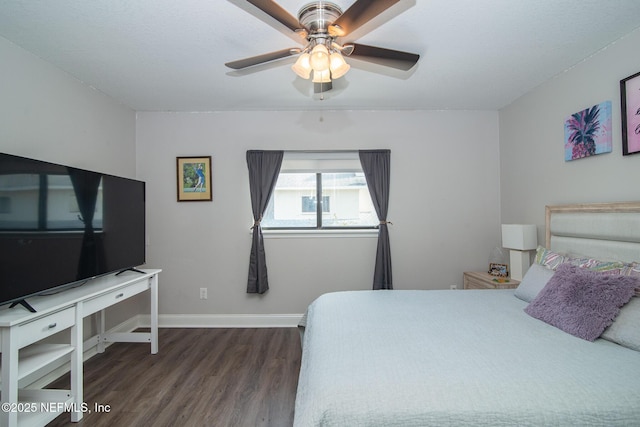 bedroom featuring dark wood-type flooring and ceiling fan