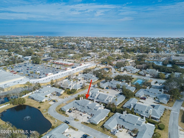 birds eye view of property featuring a water view