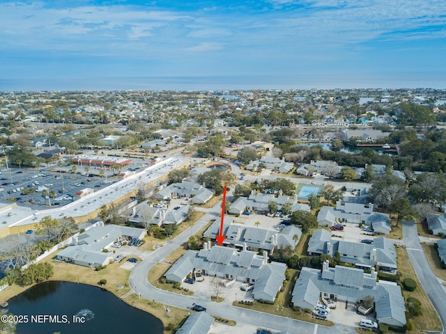 drone / aerial view with a water view