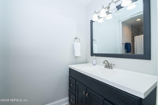 bathroom with vanity and a shower with shower curtain