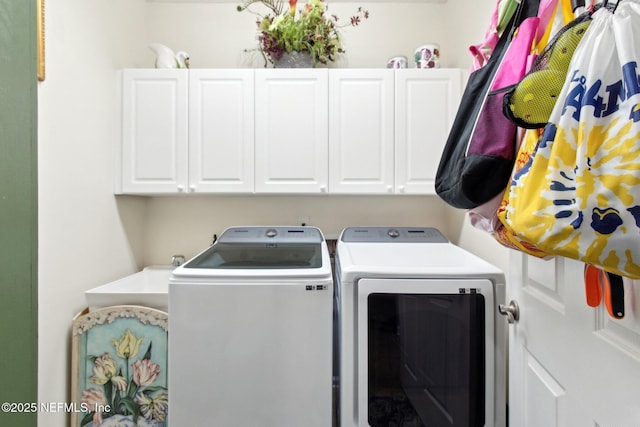 laundry room featuring cabinet space and washer and dryer