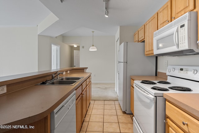 kitchen with light tile patterned flooring, light brown cabinetry, sink, hanging light fixtures, and white appliances