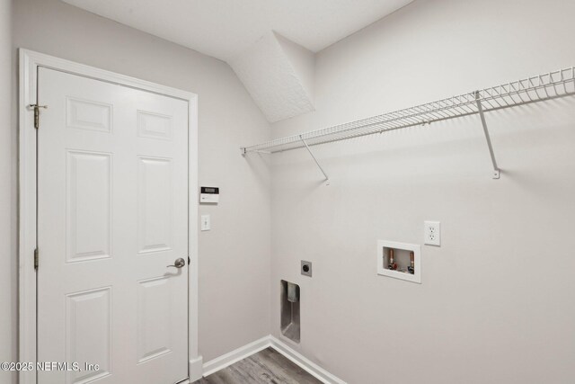 909 Thoroughbred Dr, Orange Park, FL 32065 - laundry area featuring washer hookup, wood finished floors, baseboards, hookup for an electric dryer, and laundry area