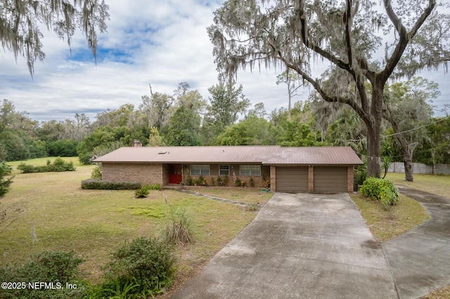 single story home with a garage and a front yard