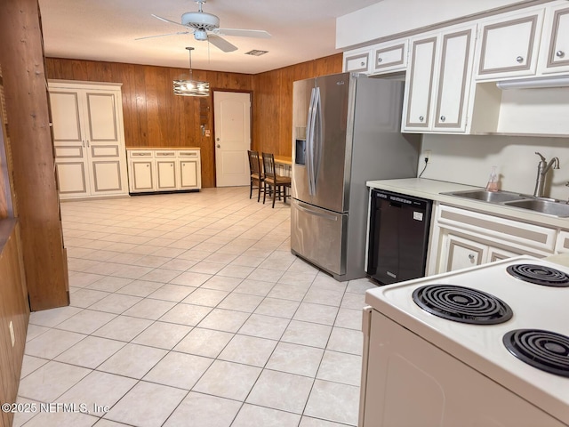 kitchen featuring light tile patterned flooring, sink, wooden walls, white electric stove, and black dishwasher