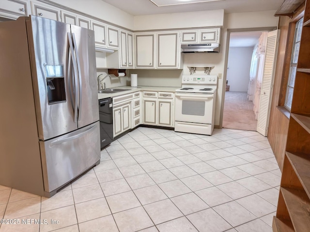 kitchen featuring stainless steel fridge, dishwasher, white electric range oven, and light tile patterned floors