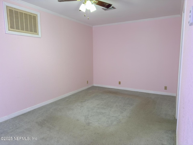 spare room with light carpet, crown molding, and ceiling fan