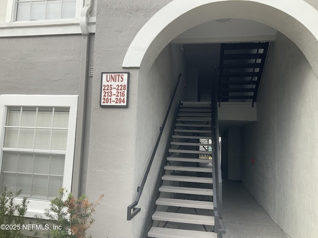 stairway with concrete floors