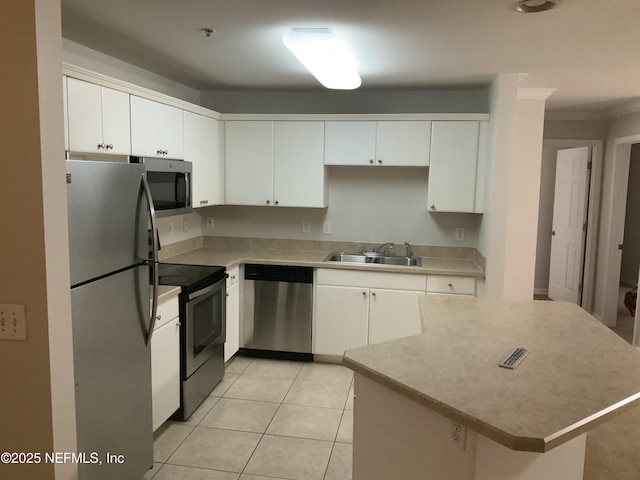 kitchen with sink, white cabinets, and appliances with stainless steel finishes