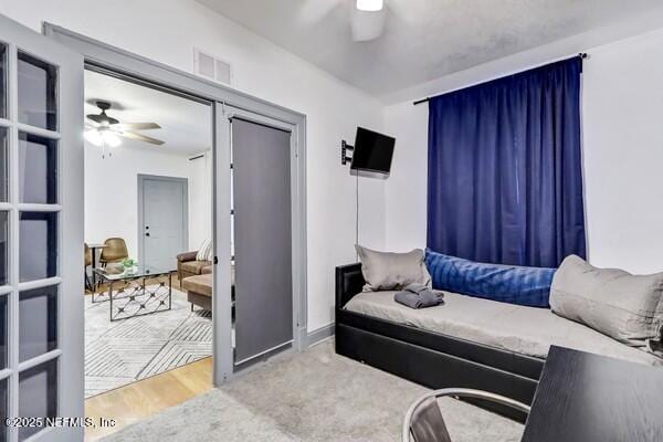 bedroom featuring ceiling fan and carpet flooring