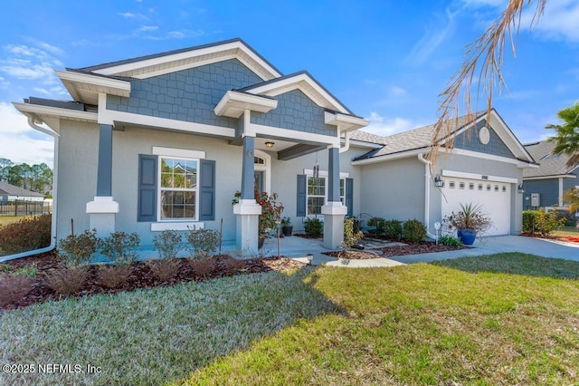 view of front of home with a garage and a front yard