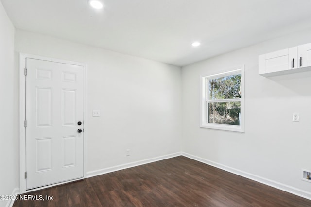 unfurnished room featuring dark hardwood / wood-style floors