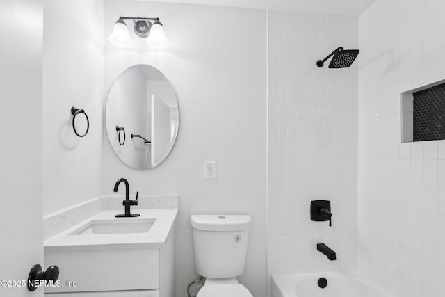 full bathroom with vanity, tiled shower / bath combo, and toilet