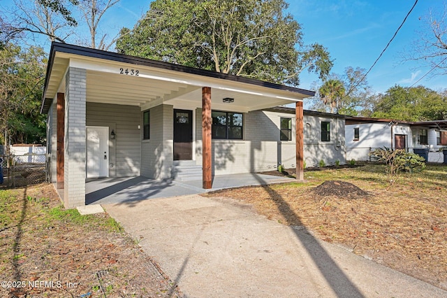 view of front of property with a carport