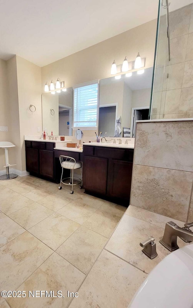 bathroom with tile patterned floors and vanity