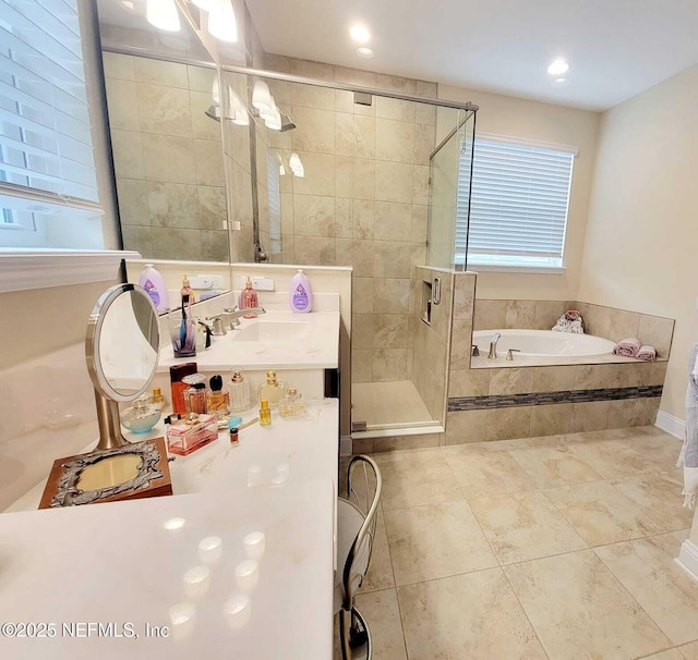 bathroom with vanity, tile patterned floors, and independent shower and bath