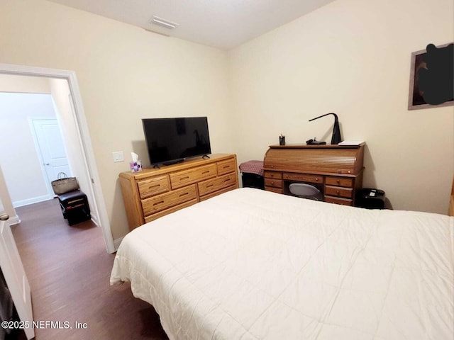 bedroom featuring dark wood-type flooring