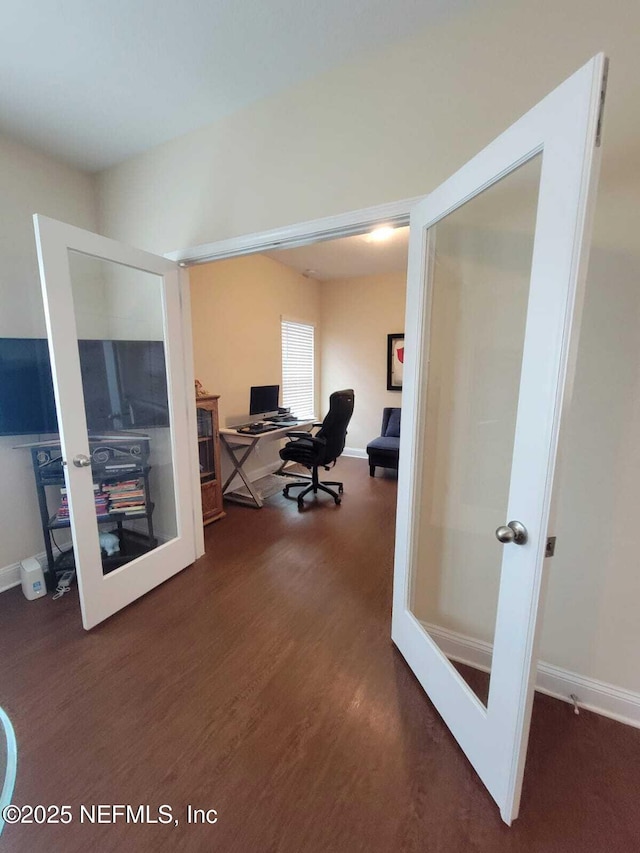 office area with dark wood-type flooring and french doors