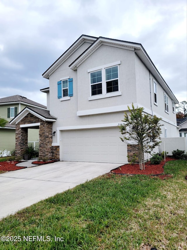 view of front of house with a garage and a front lawn