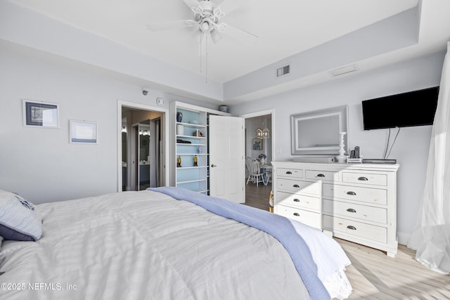 bedroom with light hardwood / wood-style flooring and ceiling fan