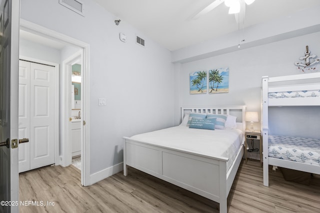 bedroom with ceiling fan and light hardwood / wood-style floors