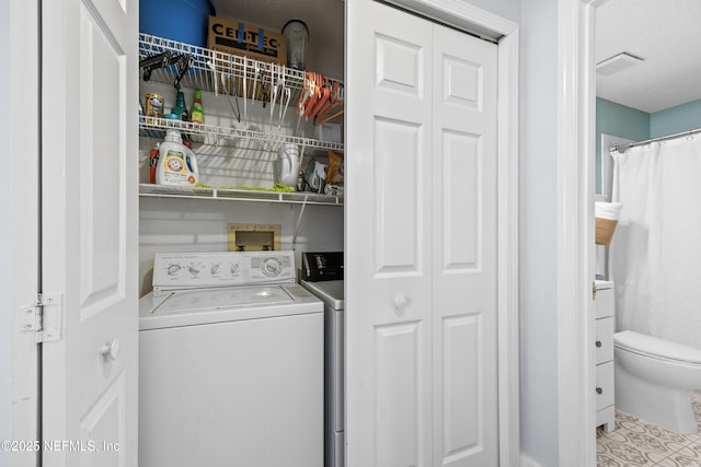 clothes washing area with independent washer and dryer