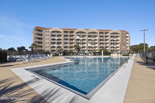 view of swimming pool featuring a patio area