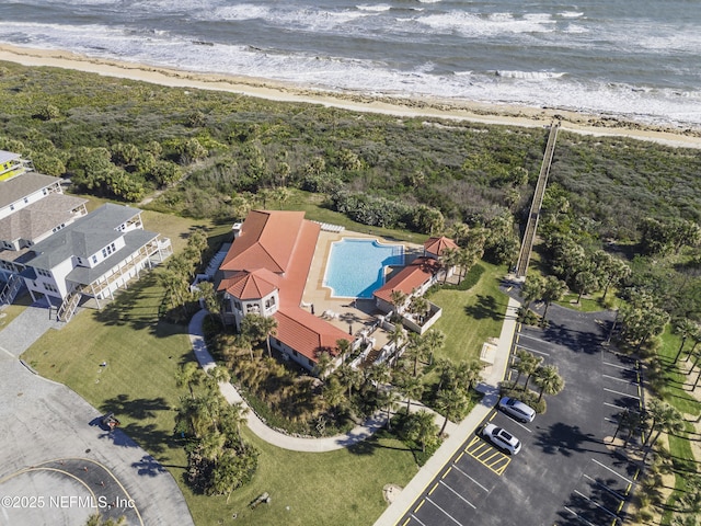 bird's eye view featuring a view of the beach and a water view