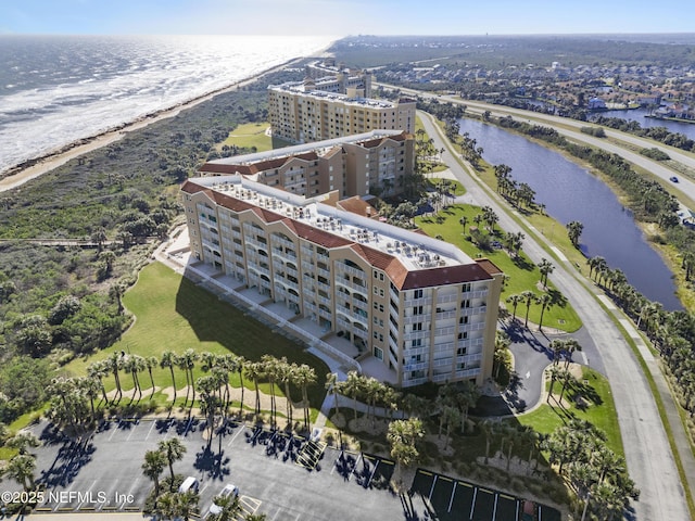 birds eye view of property featuring a water view and a view of the beach