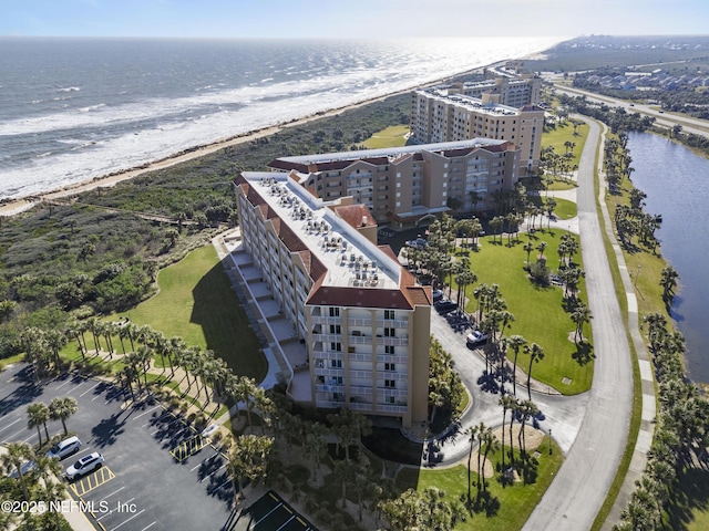 aerial view featuring a view of the beach and a water view