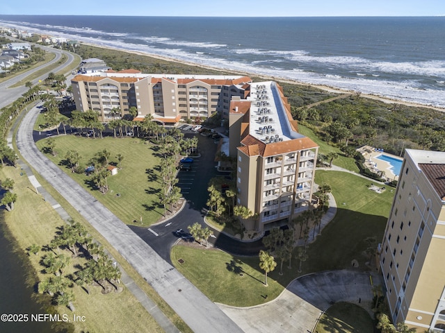 bird's eye view with a water view and a view of the beach