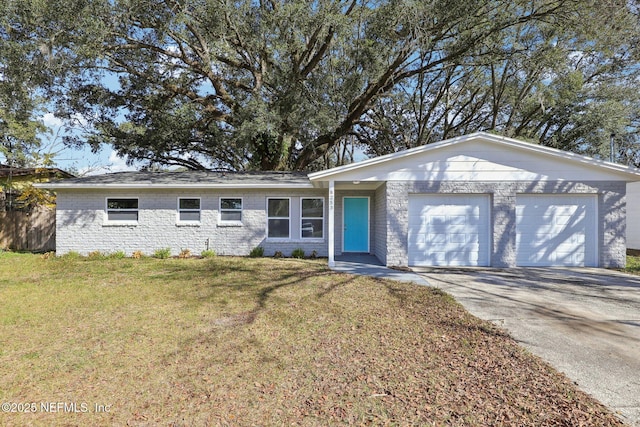 single story home featuring a garage and a front lawn