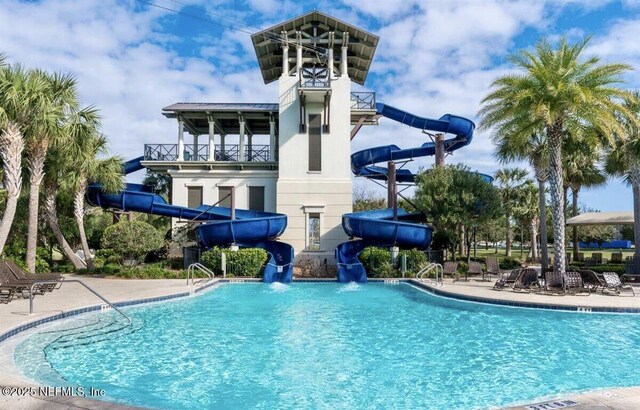 view of pool featuring a water slide