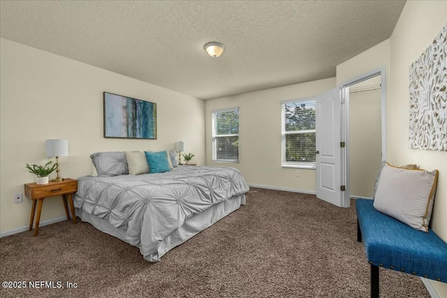 carpeted bedroom featuring a textured ceiling