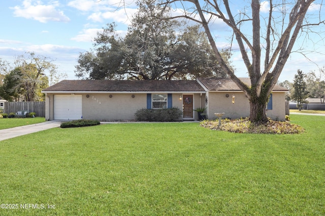 ranch-style house featuring a garage and a front lawn