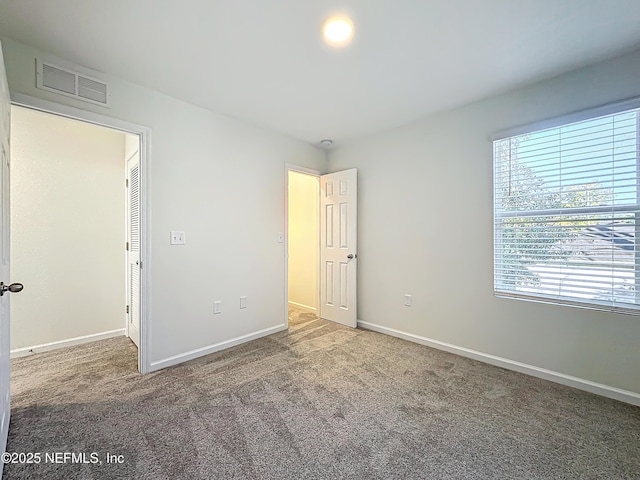 unfurnished bedroom featuring carpet floors