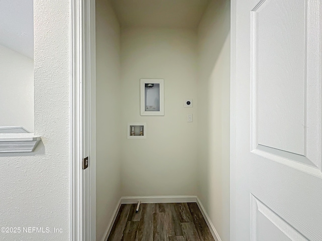 washroom featuring dark hardwood / wood-style flooring, washer hookup, and hookup for an electric dryer