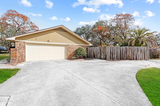 view of side of home with a garage