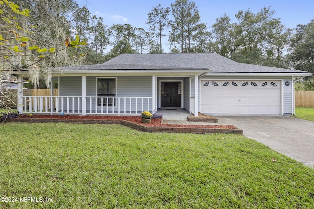 ranch-style house featuring a garage, covered porch, and a front lawn