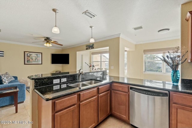 kitchen with stainless steel dishwasher, plenty of natural light, sink, and light tile patterned floors