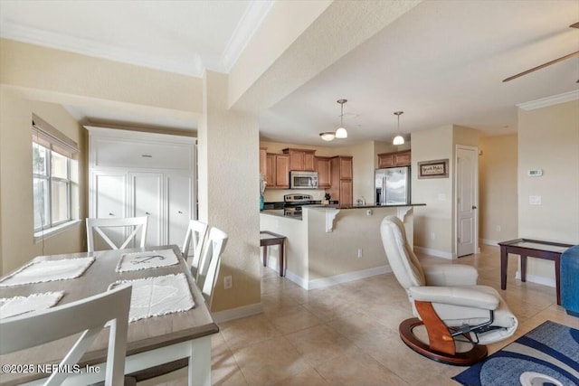 dining room with crown molding and light tile patterned flooring