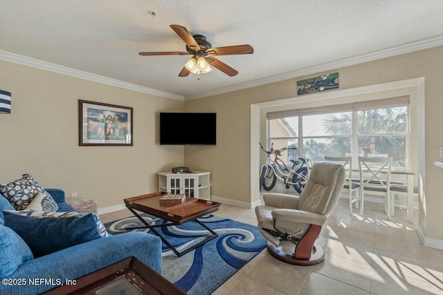 living room featuring light tile patterned flooring, ornamental molding, ceiling fan, and a textured ceiling