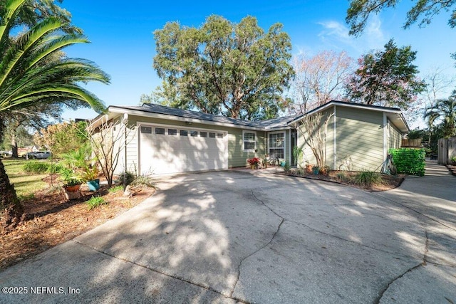 single story home featuring a garage