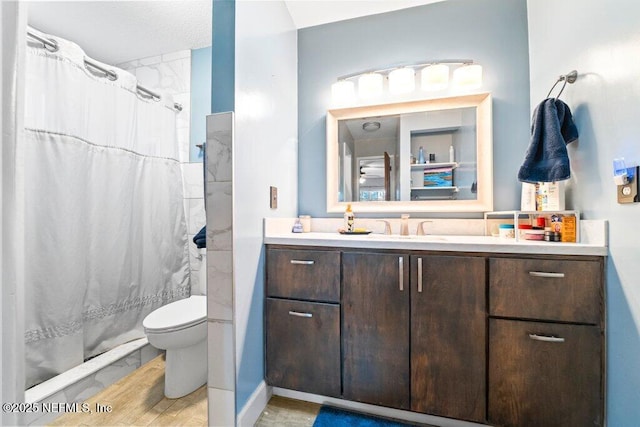 bathroom with vanity, toilet, and a shower with shower curtain