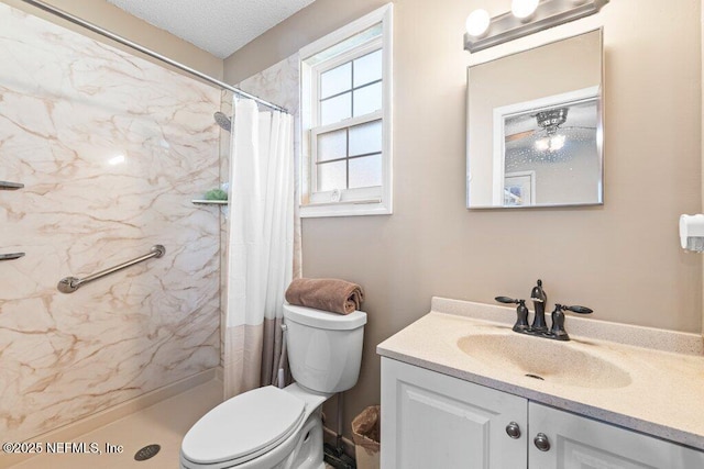 bathroom featuring vanity, curtained shower, and toilet